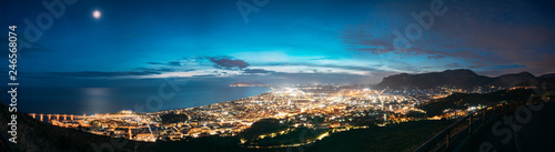 Terracina, Italy. Top View Skyline Cityscape City In Evening Night Illuminations. Panorama, Panoramic View