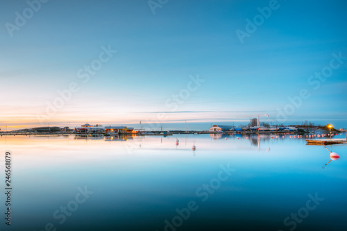 Helsinki  Finland. Landscape With City Pier  Jetty At Winter Sunrise Time.  Tranquil Sea Water Surface At Early Morning