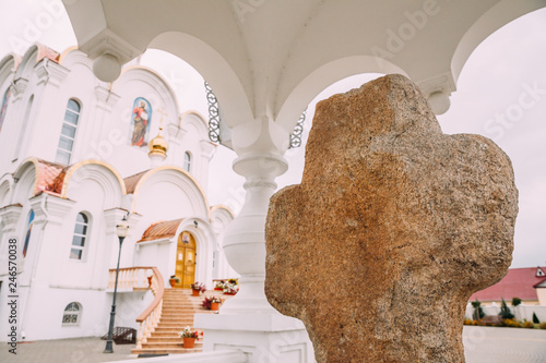 Turov, Belarus. Stone Cross On Background Cathedral Of St. Kirill And Lavrenty Turovsky photo