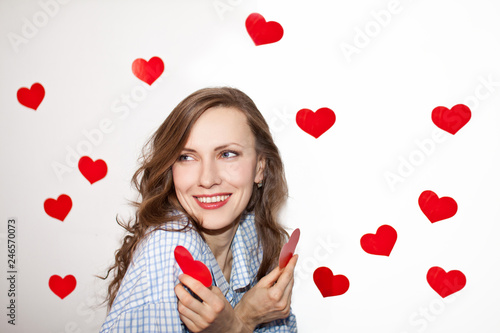 Brunette girl with red hearts isolated on white