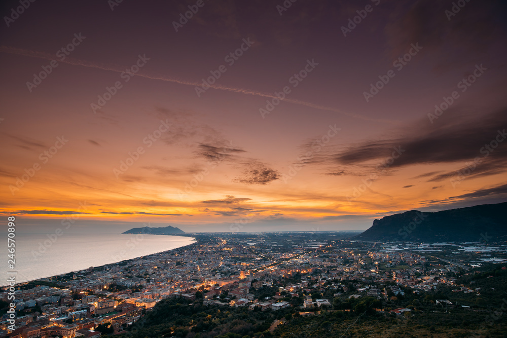 Terracina, Italy. Top View Skyline Cityscape City In Evening Sunset. City Illuminations