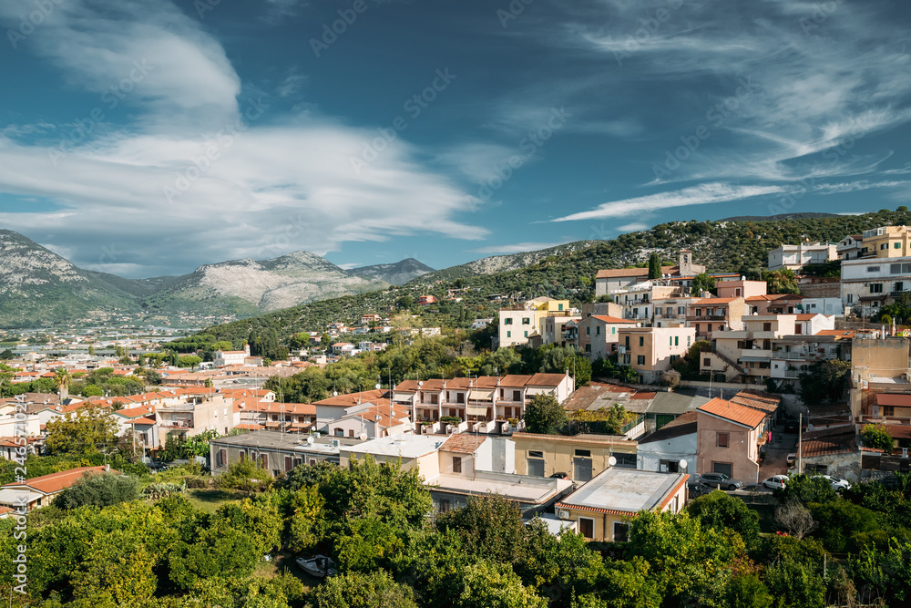 Terracina, Italy. Top View Of Residential Area. Hilly Cityscape In Summer Sunny Day Under Blue Cloudy Sky