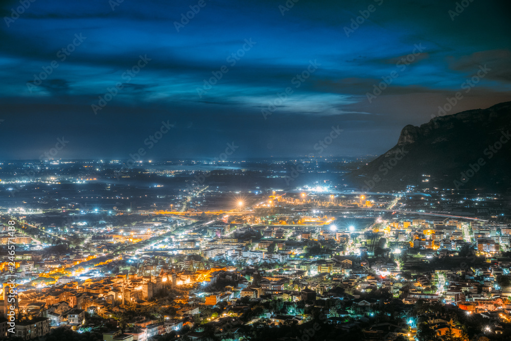 Terracina, Italy. Top Cityscape In Evening Night Illuminations