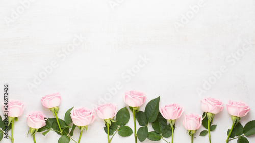 Fototapeta Naklejka Na Ścianę i Meble -  Flowers valentine day composition. Frame made of pink rose on gray background. Flat lay, top view, copy space.