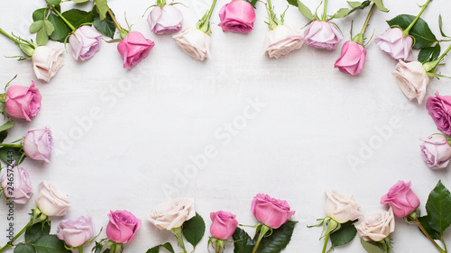 Fototapeta Naklejka Na Ścianę i Meble -  Flowers valentine day composition. Frame made of pink rose on gray background. Flat lay, top view, copy space.