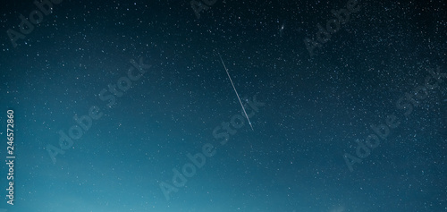 Night Starry Sky With Glowing Stars And Meteoric Track Trail. Meteorite Trail In Starry Sky Background © Grigory Bruev