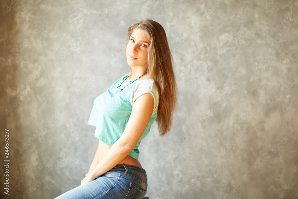 Beautiful russian girl posing for photo in the home loft studio