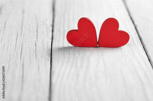 Valentine background with handmade hearts on rustic wood