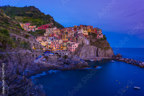 Manarola - Village of Cinque Terre National Park at Coast of Italy. Beautiful colors at sunset. Province of La Spezia, Liguria, in the north of Italy