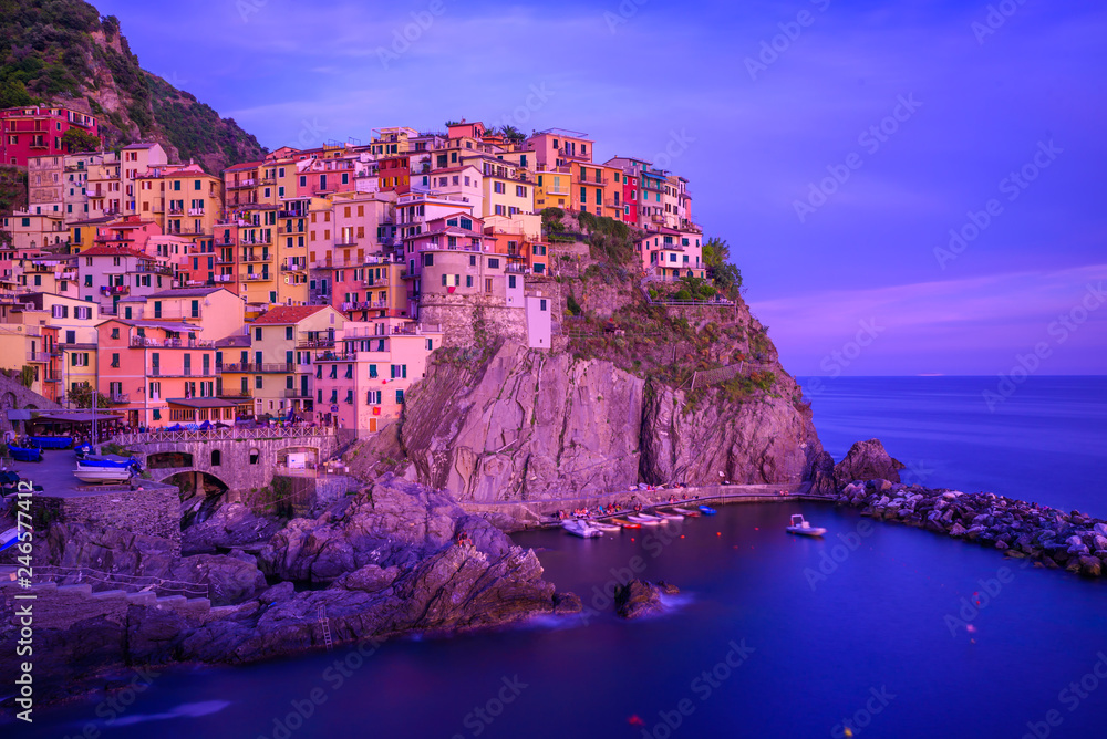 Manarola - Village of Cinque Terre National Park at ligurian coast of Italy. Beautiful colors at sunset. Province of La Spezia, Liguria, in the north of Italy, Europe.