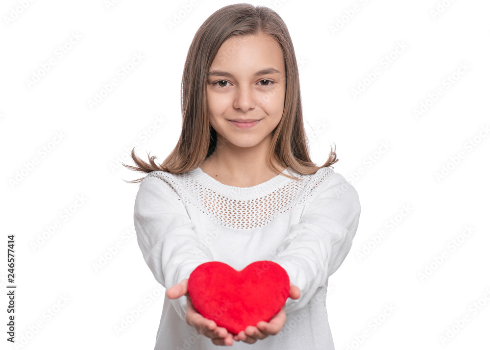 Happy Valentines Day. Cute young Teen Girl in Love with Red plush Heart in her hands. Smiling Child looking at camera, isolated on white background. Happy Valentines Day. Cute young Teen Girl in Love with Red plush Heart in her hands. Smiling Child looking at camera, isolated on white background.