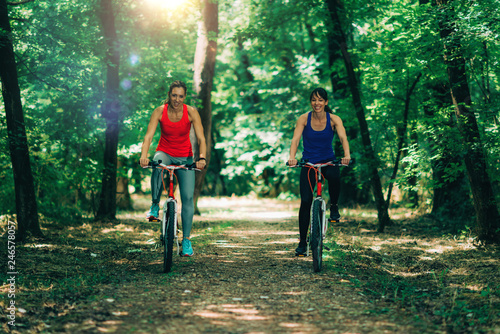 Women Riding Bikes Together