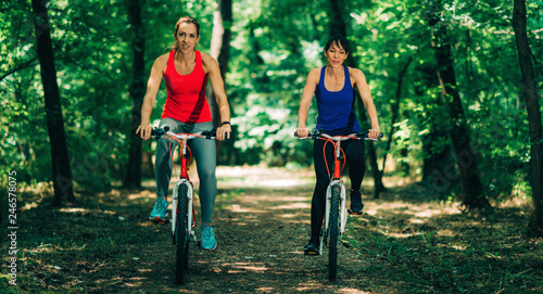 Two Women Cycling Together