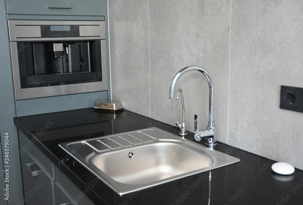 Fototapeta premium Modern kitchen sink, water tap and chrome faucet for kitchen basin