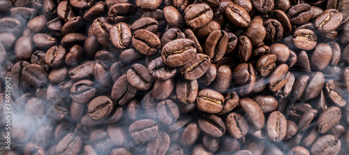 Roasted coffee beans. Food and drink background. Top view.
