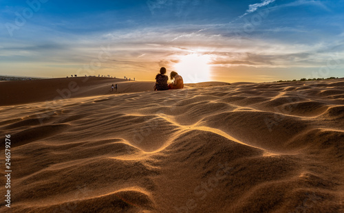 MUI NE  VIETNAM - JANUARY 18  2019   Unidentified tourists are traveling red sand dunes in Binh Thuan near the town of Mui Ne  Vietnam. Mui Ne is popular travel destination with long coastline..