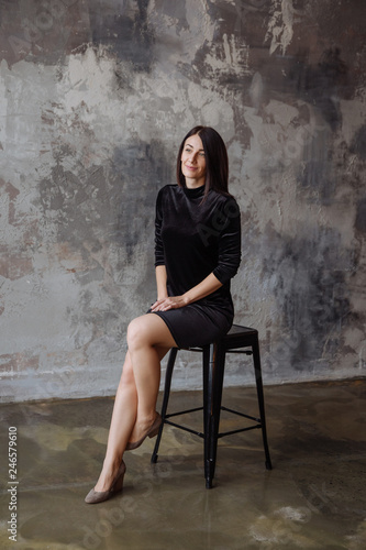 Full-length portrait of a smiling girl indoors