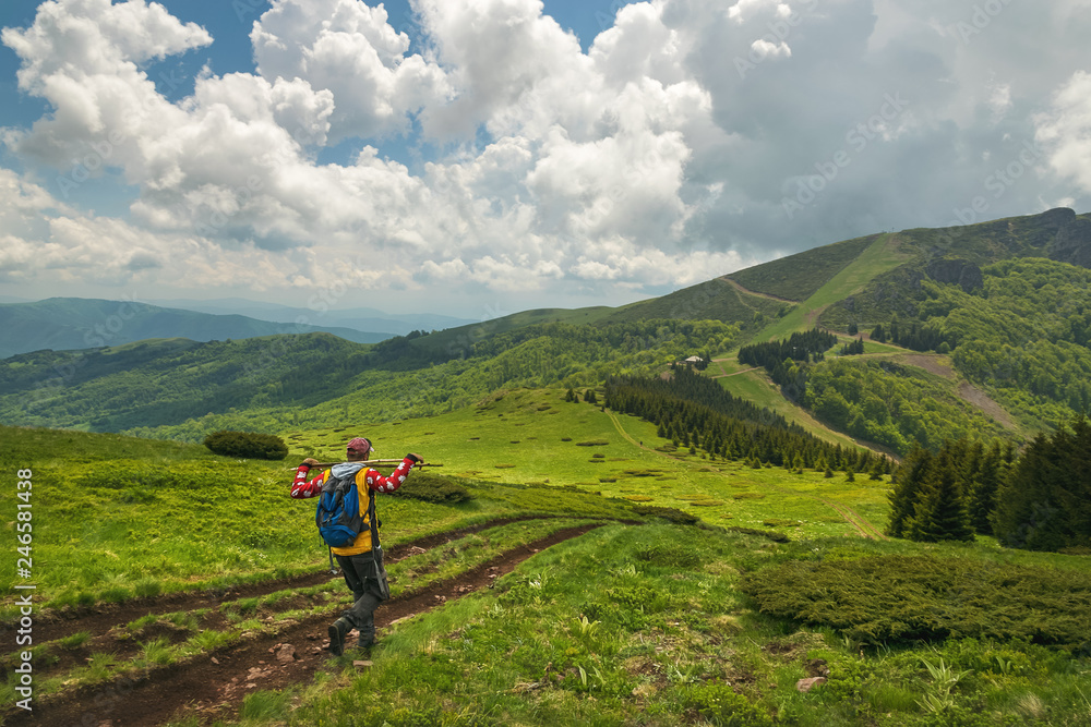 Man hiking on the mountain. Beautiful landscape on Stara Planina mountain in Serbia.