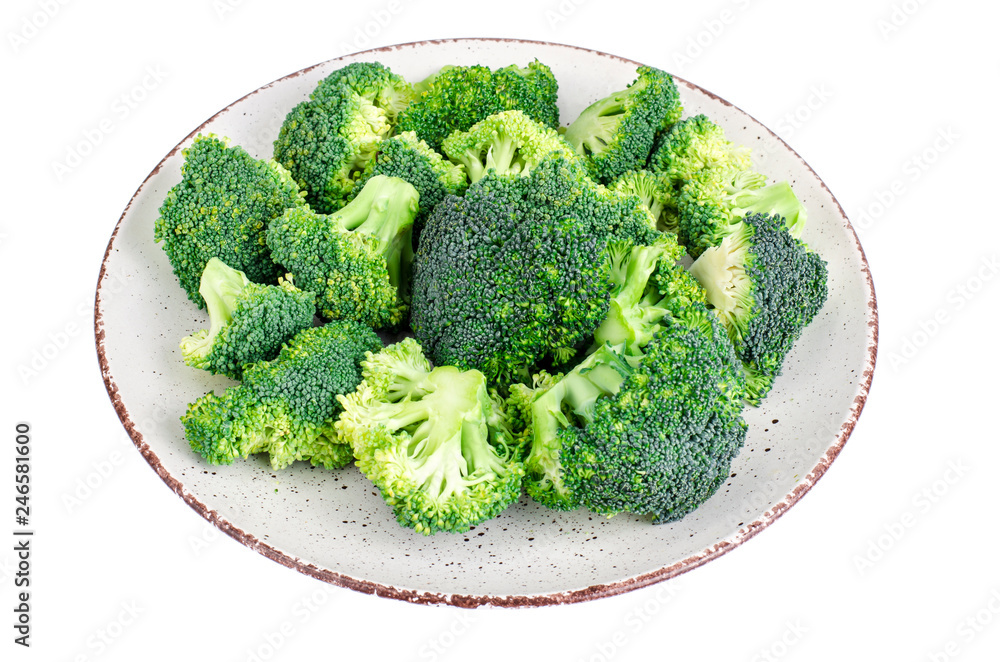 Plate with chopped broccoli buds isolated on white background Plate with chopped broccoli buds isolated on white background