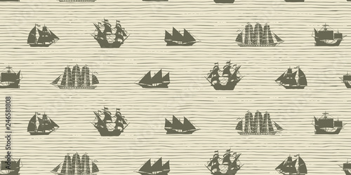 Vector seamless background on the theme of sea travel with various sailing ships. Sea objects on the striped background in retro style © paseven