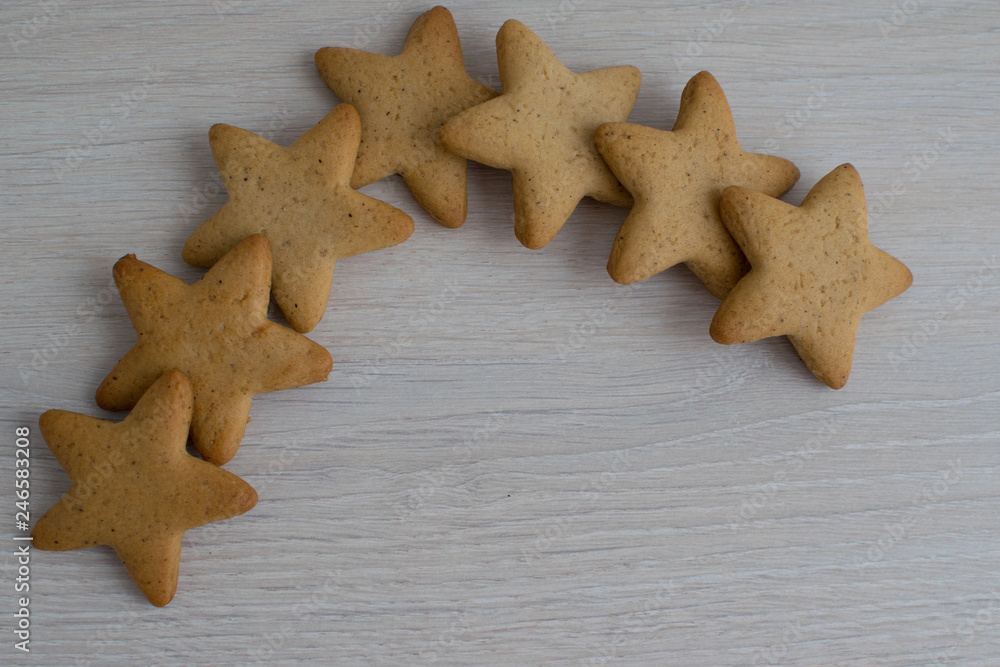 gingerbread in the form of stars on a bright table are a group gingerbread in the form of stars on a bright table are a group
