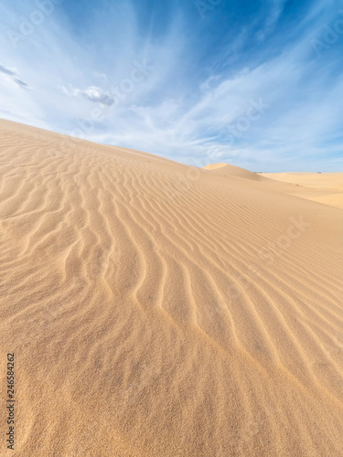 White sand dunes and blue sky background in Mui Ne   South of Vietnam
