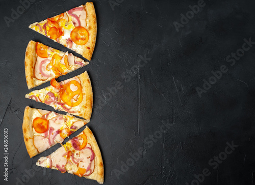 Delicious pizza on a concrete background. Top view of hot pizza. 