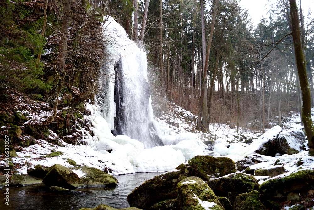 Winter waterfall and boulders - Tercino udoli, Nove Hrady, South Bohemia Winter waterfall and boulders - Tercino udoli, Nove Hrady, South Bohemia