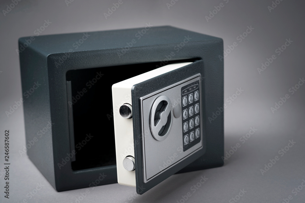 Open safe on gray background Open safe on gray background