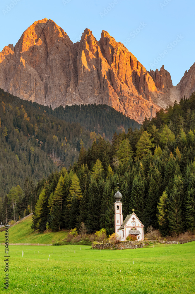 Santa Magdalena Village Church at the foot of the Dolomites Alps in Italy
