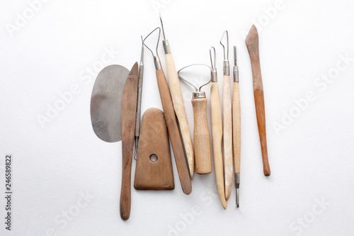 composition of tools for sculptors on white background photo