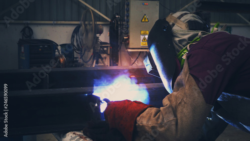 Welder is welding flux cored arc welding  Industrial welding part in Oil and Gas or Petrochemical ,Copy space for you text.