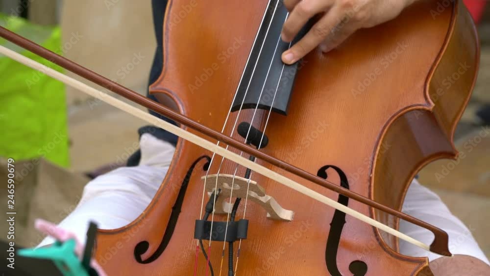 Street musician playing violin. Street musician playing violin.