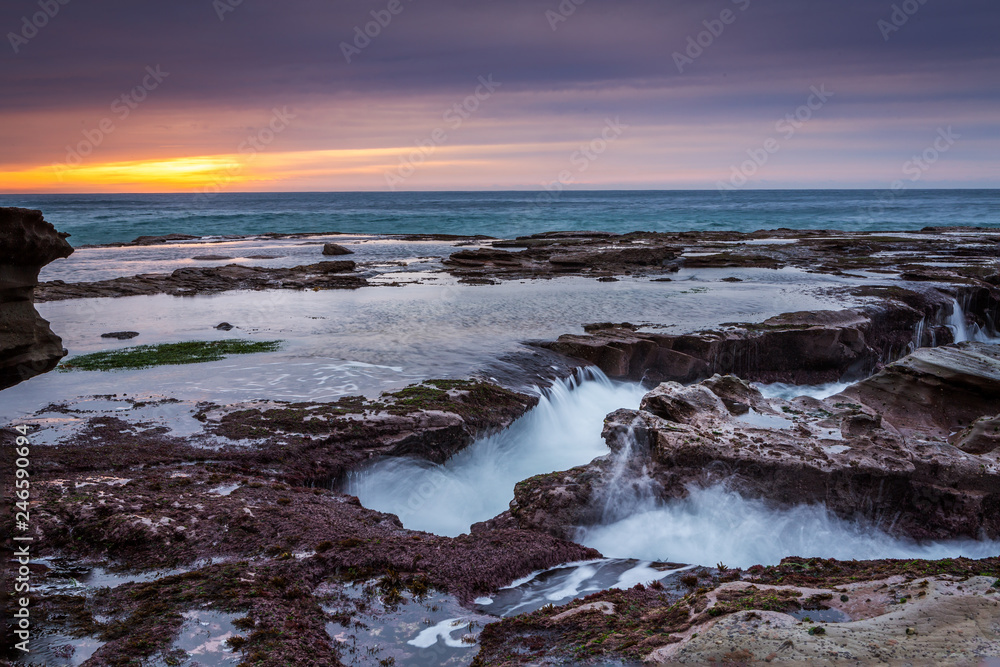 Ocean eroding out channels in the rocks