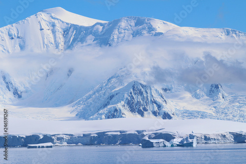 Icebergs and mountains in Antarctica. Mountains along the coast of the Antarctic Peninsula