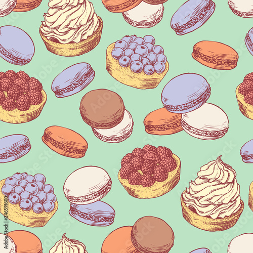 Seamless pattern with hand drawn creamy biscuit, french macaroons and tarts with berries. Hand drawn vector illustration in vintage engraving style on light green background. Sweet colorful dessert