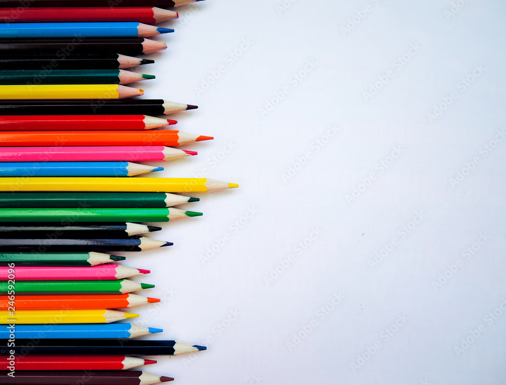 Color pencils on white background. Flat lay, top view, copy space Color pencils on white background. Flat lay, top view, copy space