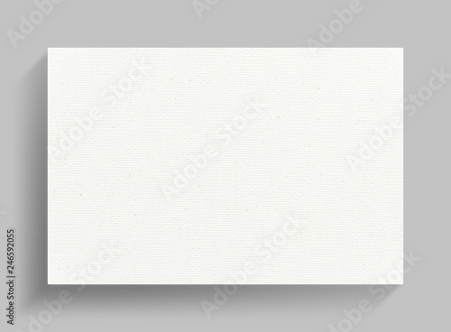 White canvas frame on gray wall background.