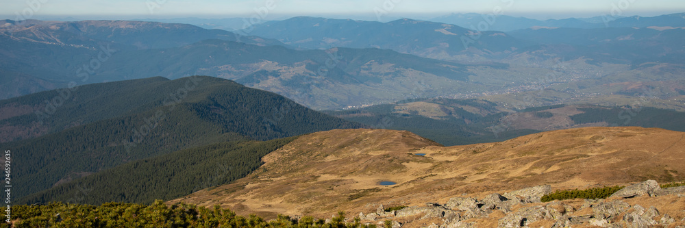 Panoramic view of idyllic mountain scenery in sunny day Panoramic view of idyllic mountain scenery in sunny day