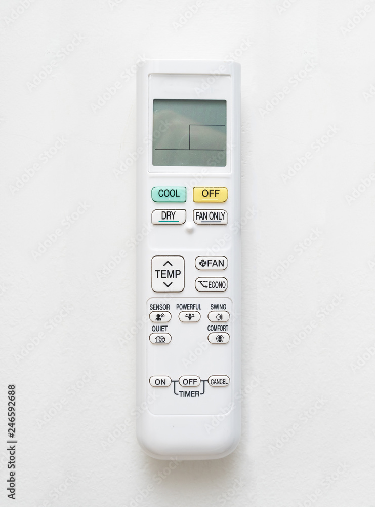 Air conditioner remote control on concrete wall background. Air conditioner remote control on concrete wall background.