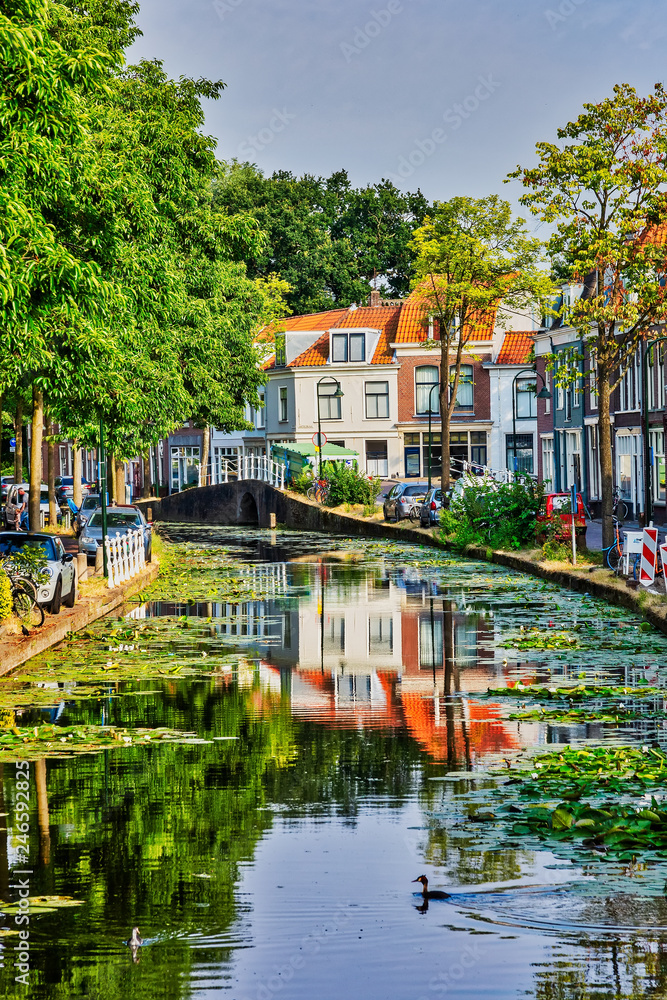 Delft city view with canals in Holland