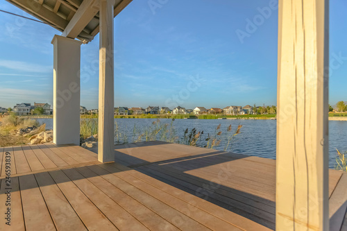 Oquirrh Lake viewed from a patio on a sunny day © Jason