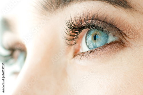 Girl's eyes, blue, close-up. The concept of vision correction or lenses.