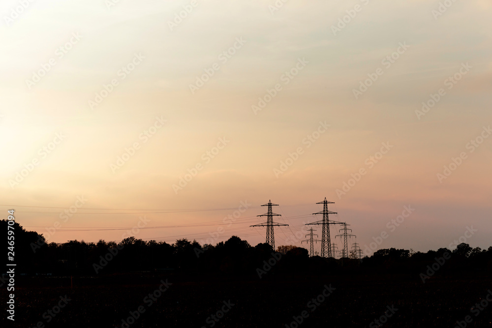 Electricity towers lined up into the distance.