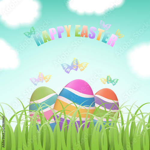 Colorful Easter eggs hiding in green grass field with flying butterflies, blue sky and clouds