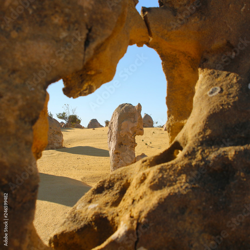 View at Pinnacles desert through a hole in one of the pillars, Nambung National Park, Western Australia © Ines Porada