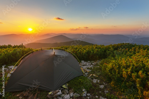 Rest in the summer in the Ukrainian Carpathians with overnight stay in a tent on a mountain top.