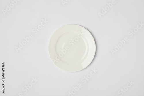 top view of porcelain plate on grey background