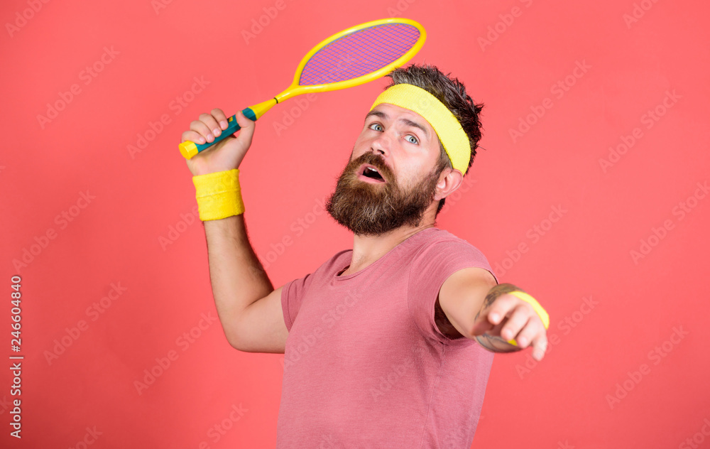 Man bearded hipster wear sport outfit. Tennis player retro fashion. Tennis sport and entertainment. Athlete hipster hold tennis racket in hand red background. Play tennis for fun. Reach top again Man bearded hipster wear sport outfit. Tennis player retro fashion. Tennis sport and entertainment. Athlete hipster hold tennis racket in hand red background. Play tennis for fun. Reach top again