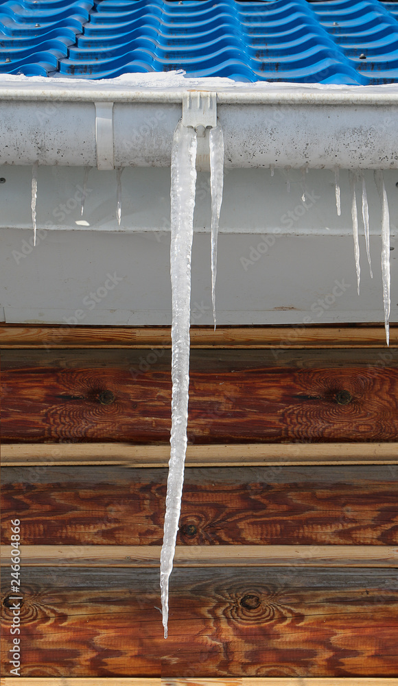 icicle hanging from the roof icicle hanging from the roof